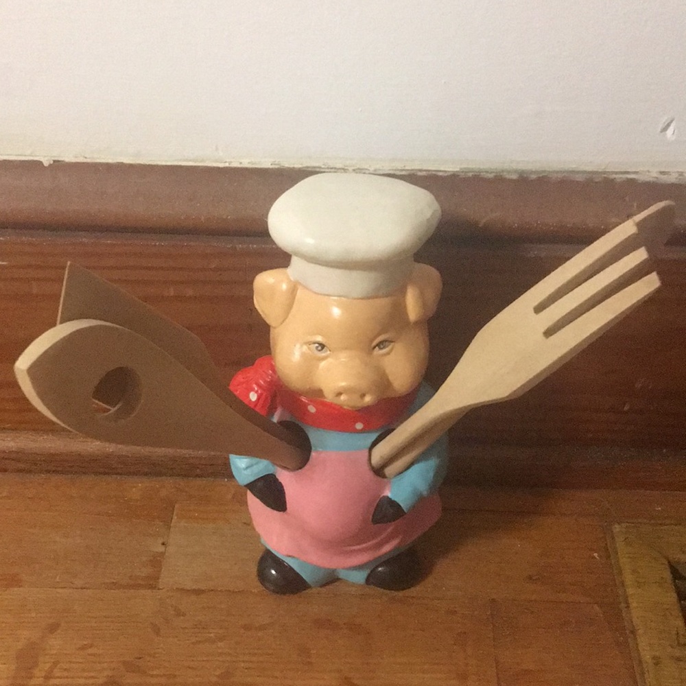 Pig chef with utensils